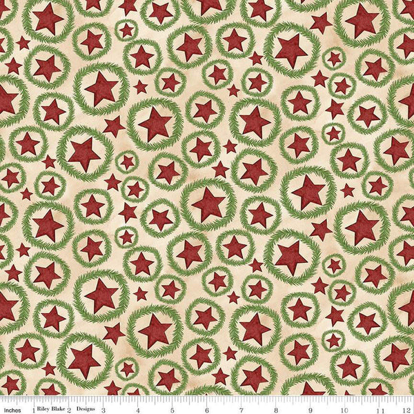 Image of the Up on the Housetop Star Wreaths Snowflake quilting cotton fabric by Riley Blake Designs. Features stars inside of a pine needle wreath on a cream background. 
Cute Little Fabric Shop