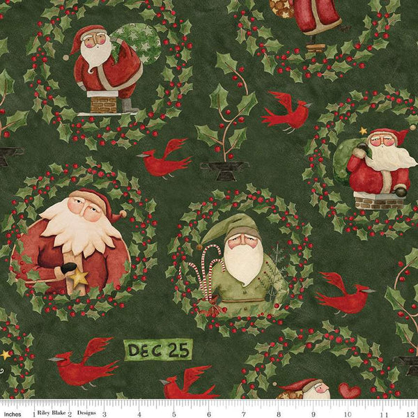 Image of the Up on the Housetop Santa Holly Green quilting cotton fabric by Riley Blake Designs. Features different Santas encircled in holly and berry wreaths on a dark green background. 
Cute Little Fabric Shop