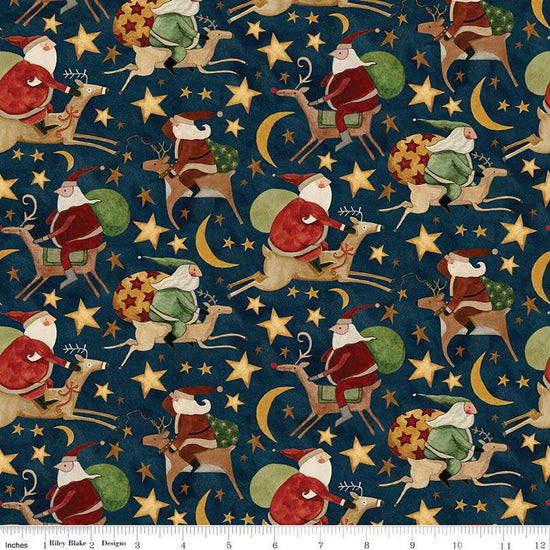 Image of the Up on the Housetop Santa Rides Midnight quilting cotton fabric by Riley Blake Designs. Features Santas riding reindeer with a background of stars and moons on a dark blue background. 
Cute Little Fabric Shop