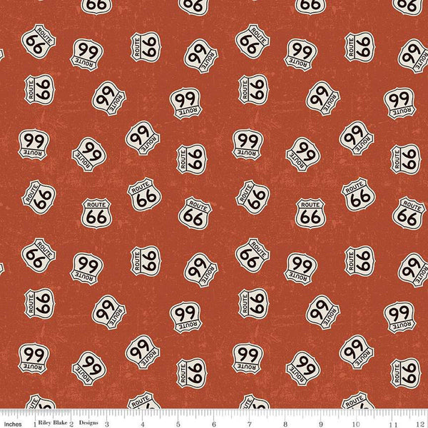 Rust, red colored quilting cotton fabrics with scattered Route 66 signs. 
Cute Little Fabric Shop