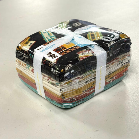 Picture of Riley Blake&#39;s Route 66 Fat Quarter Bundle. It features 18 pieces, and is tied shut with a ribbon. 
Cute Little Fabric Shop