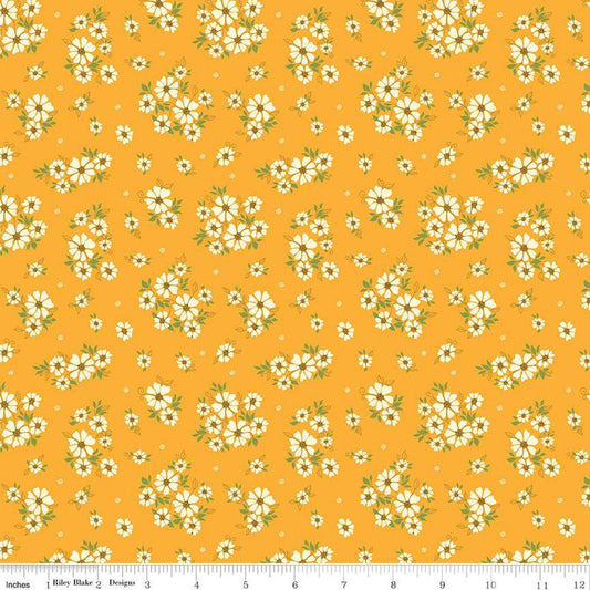 Image of the Autumn Afternoon Daisies Saffron quilting cotton fabric by Heather Peterson for Riley Blake Designs. Features clusters of white flowers with green leaves on a yellow background. 
Cute Little Fabric Shop