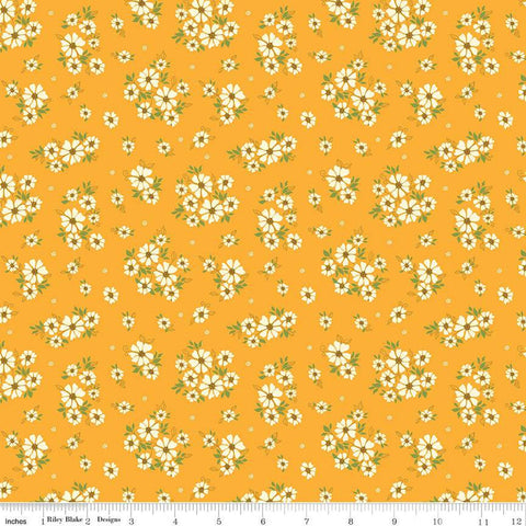 Image of the Autumn Afternoon Daisies Saffron quilting cotton fabric by Heather Peterson for Riley Blake Designs. Features clusters of white flowers with green leaves on a yellow background. 
Cute Little Fabric Shop