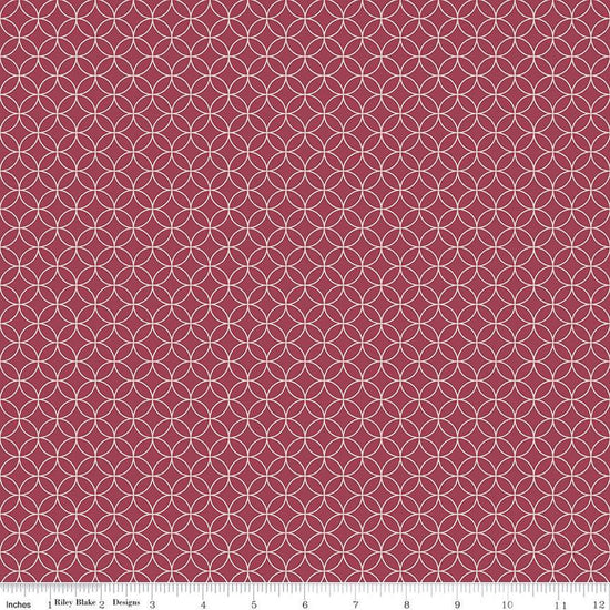 Image of the Autumn Afternoon Pumpkin Seeds Berry quilting cotton fabric by Heather Peterson for Riley Blake Designs. Features an orange peel geometric design on a dark pink purple wine colored background. 
Cute Little Fabric Shop