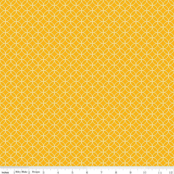 Image of the Autumn Afternoon Pumpkin Seeds  Saffron quilting cotton fabric by Heather Peterson for Riley Blake Designs. Features an orange peel geometric design on a yellow colored background. 
Cute Little Fabric Shop