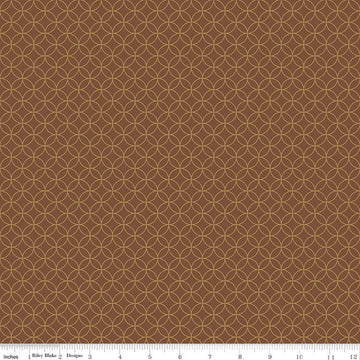 Image of the Autumn Afternoon Pumpkin Seeds  Brown quilting cotton fabric by Heather Peterson for Riley Blake Designs. Features an orange peel geometric design on a brown colored background. 
Cute Little Fabric Shop
