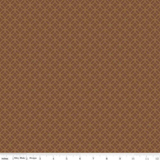 Image of the Autumn Afternoon Pumpkin Seeds  Brown quilting cotton fabric by Heather Peterson for Riley Blake Designs. Features an orange peel geometric design on a brown colored background. 
Cute Little Fabric Shop