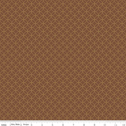 Image of the Autumn Afternoon Pumpkin Seeds  Brown quilting cotton fabric by Heather Peterson for Riley Blake Designs. Features an orange peel geometric design on a brown colored background. 
Cute Little Fabric Shop