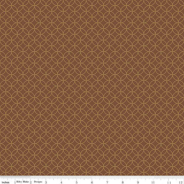 Image of the Autumn Afternoon Pumpkin Seeds  Brown quilting cotton fabric by Heather Peterson for Riley Blake Designs. Features an orange peel geometric design on a brown colored background. 
Cute Little Fabric Shop