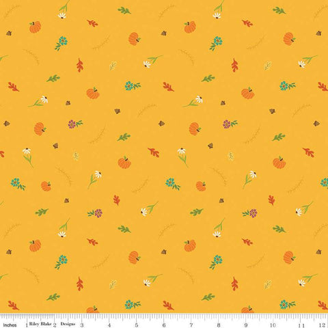 Image of the Autumn Afternoon Fall Toss Saffron quilting cotton fabric by Heather Peterson for Riley Blake Designs. Features scattered flowers, pumpkins, and acorns on a yellow background. 
Cute Little Fabric Shop