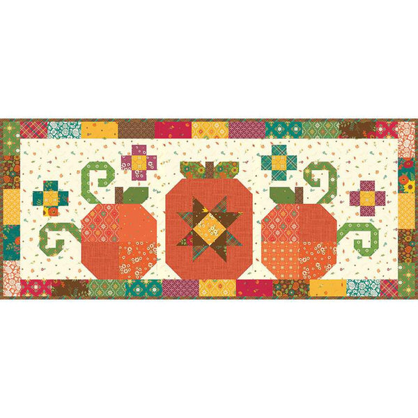 Image of the Heather Peterson Pumpkin Trio Runner Pattern by Riley Blake Designs. Features pieced pumpkins on a cream background with red, yellow, green, and brown fabrics on the border. 
Cute Little Fabric Shop