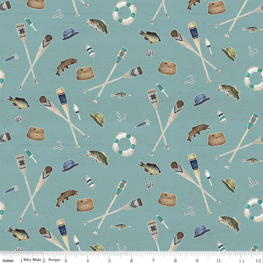 Teal blue quilting cotton fabric featuring Riley Blake Design's Wake at the Lake Icons blue. Image includes oars, fish, hats, bait, and more scattered around. 
Cute Little Fabric Shop