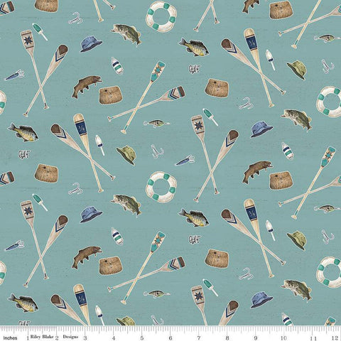 Teal blue quilting cotton fabric featuring Riley Blake Design&#39;s Wake at the Lake Icons blue. Image includes oars, fish, hats, bait, and more scattered around. 
Cute Little Fabric Shop