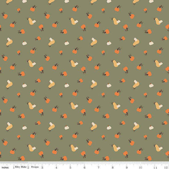 Image of olive green colored quilting cotton fabric for the Pumpkin Spice collection by Riley Blake Designs. Features scattered and tossed orange, yellow, and cream pumpkins on the olive background. 
Cute Little Fabric Shop