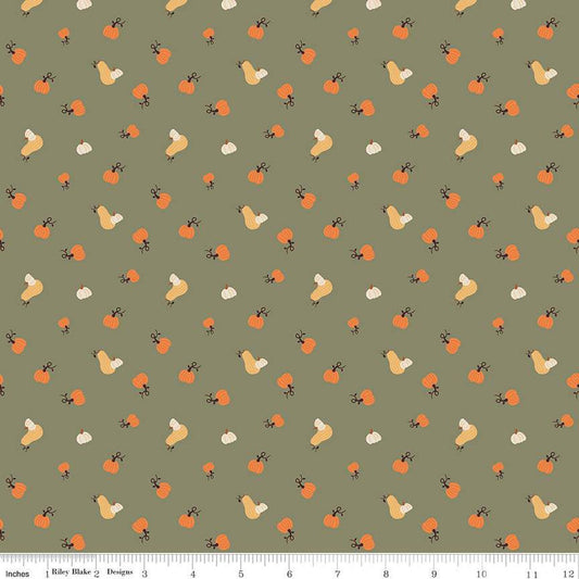 Image of olive green colored quilting cotton fabric for the Pumpkin Spice collection by Riley Blake Designs. Features scattered and tossed orange, yellow, and cream pumpkins on the olive background. 
Cute Little Fabric Shop