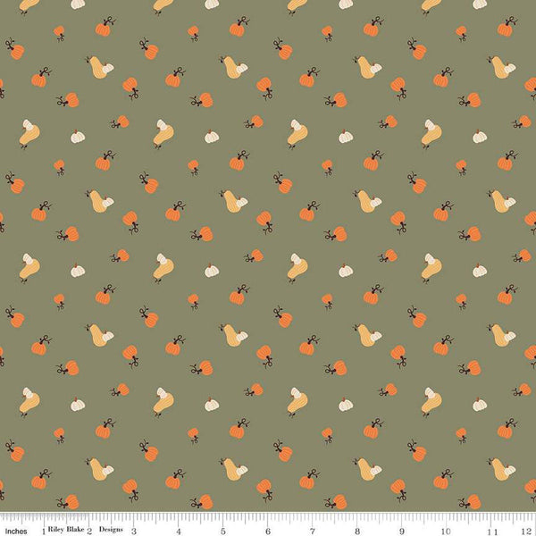 Image of olive green colored quilting cotton fabric for the Pumpkin Spice collection by Riley Blake Designs. Features scattered and tossed orange, yellow, and cream pumpkins on the olive background. 
Cute Little Fabric Shop