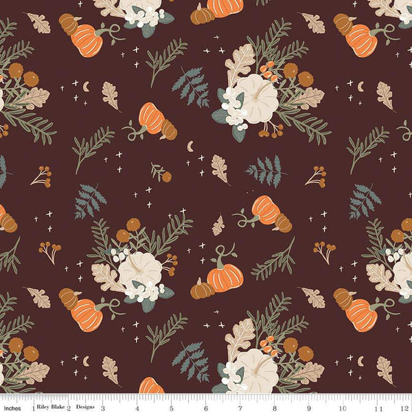 Image of espresso brown colored quilting cotton fabric for the Pumpkin Spice collection by Riley Blake Designs. Features scattered clusters of pumpkins, flowers, and branches of leaves on the dark brown background. 
Cute Little Fabric Shop