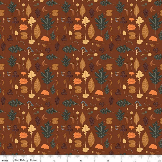 Image of brown colored quilting cotton fabric for the Pumpkin Spice collection by Riley Blake Designs. Features scattered various leaves on a brown background. 
Cute Little Fabric Shop