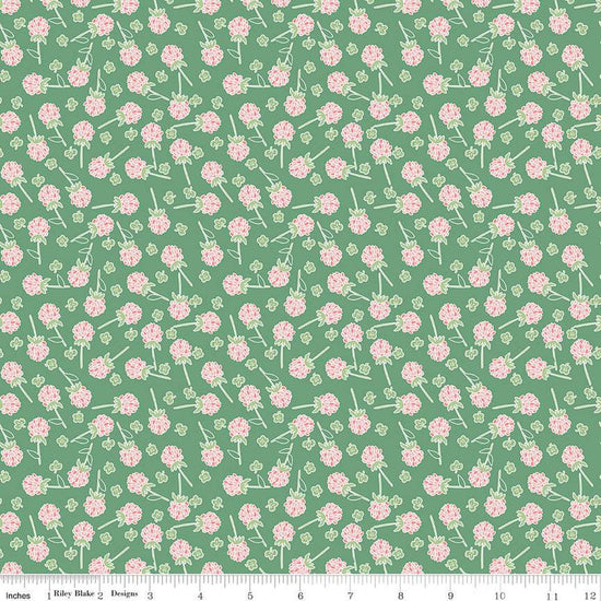 Clover Farm from Riley Blake Designs. Image depicts scattered pink clovers on a green background. Quilting cotton fabric. 
Cute Little Fabric Shop