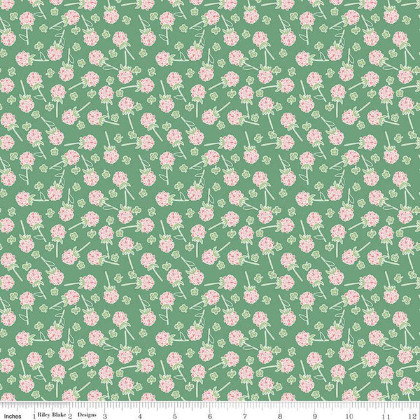 Clover Farm from Riley Blake Designs. Image depicts scattered pink clovers on a green background. Quilting cotton fabric. 
Cute Little Fabric Shop