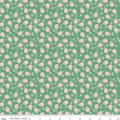 Clover Farm from Riley Blake Designs. Image depicts scattered pink clovers on a green background. Quilting cotton fabric. 
Cute Little Fabric Shop