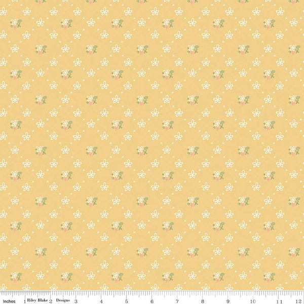 Clover Farm from Riley Blake Designs. Image depicts scattered flowers and X&#39;s on a yellow background. Quilting cotton fabric. 
Cute Little Fabric Shop