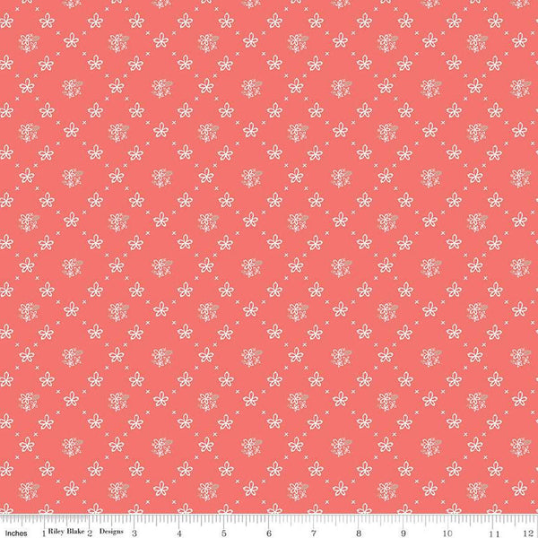 Clover Farm from Riley Blake Designs. Image depicts scattered flowers and Xs on a coral pink background. Quilting cotton fabric. 
Cute Little Fabric Shop