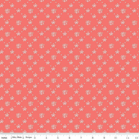 Clover Farm from Riley Blake Designs. Image depicts scattered flowers and Xs on a coral pink background. Quilting cotton fabric. 
Cute Little Fabric Shop