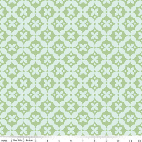 Clover Farm from Riley Blake Designs. Image depicts tiled medallion flowers scattered on a green background. Quilting cotton fabric. 
Cute Little Fabric Shop