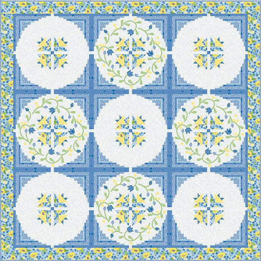 Image of the Rainy Day Blues quilt pattern. Features blue, yellow, and white fabrics in 9 circles. Sunny Skies from Riley Blake Designs. 
Cute Little Fabric Shop