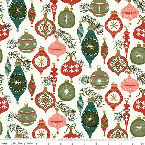 Image of Christmas Is in Town Ornaments Cream by Riley Blake Designs. Features Christmas ornaments on a light cream background with sprigs of pine needles. 
Cute Little Fabric Shop