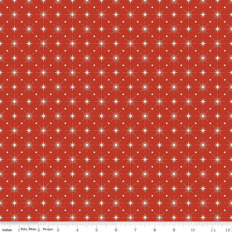 Image of Christmas Is in Town Stars Red by Riley Blake Designs. Features arranged sparkle stars on a red background. 
Cute Little Fabric Shop