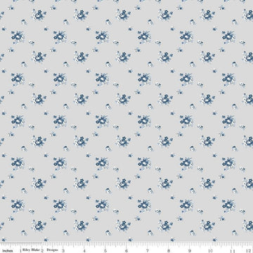 Image of the Serenity Blues Delicate Roses Taupe quilting cotton fabric by Gerri Robinson for Riley Blake Designs. Features scattered roses and small blossoms on a light gray background. 
Cute Little Fabric Shop