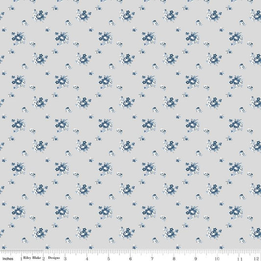 Image of the Serenity Blues Delicate Roses Taupe quilting cotton fabric by Gerri Robinson for Riley Blake Designs. Features scattered roses and small blossoms on a light gray background. 
Cute Little Fabric Shop