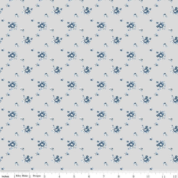 Image of the Serenity Blues Delicate Roses Taupe quilting cotton fabric by Gerri Robinson for Riley Blake Designs. Features scattered roses and small blossoms on a light gray background. 
Cute Little Fabric Shop