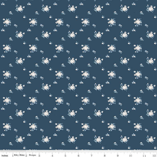 Image of the Serenity Blues Delicate Roses Navy quilting cotton fabric by Gerri Robinson for Riley Blake Designs. Features scattered flowers and small blossoms on a dark blue background. 
Cute Little Fabric Shop