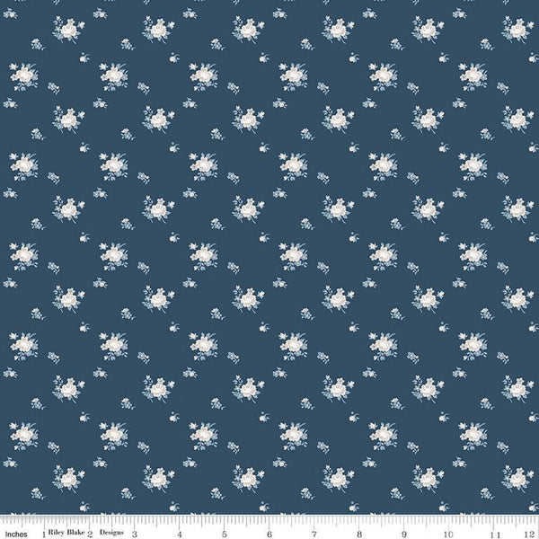 Image of the Serenity Blues Delicate Roses Navy quilting cotton fabric by Gerri Robinson for Riley Blake Designs. Features scattered flowers and small blossoms on a dark blue background. 
Cute Little Fabric Shop