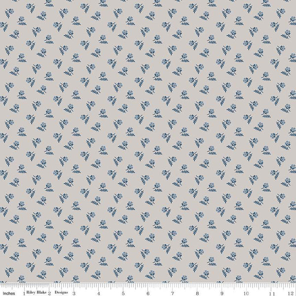 Image of the Serenity Blues Tiny Floral Taupe quilting cotton fabric by Gerri Robinson for Riley Blake Designs. Features scattered blossoms and sprigs of leaves on a light gray background. 
Cute Little Fabric Shop