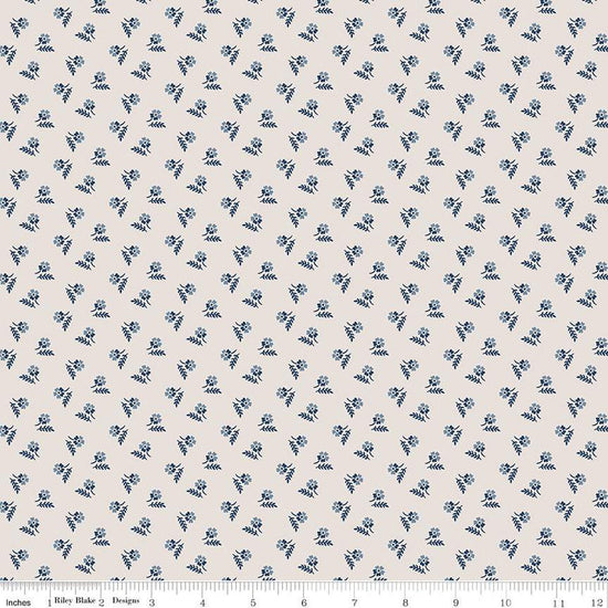 Image of the Serenity Blues Tiny Floral Beige quilting cotton fabric by Gerri Robinson for Riley Blake Designs. Features scattered blossoms and sprigs of leaves on a light tan beige background. 
Cute Little Fabric Shop