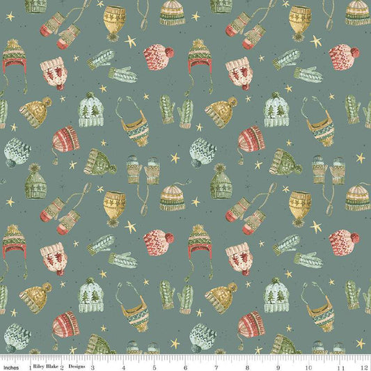 Image of the Magical Winterland Knitwear Winter quilting cotton fabric by Riley Blake Designs. Features tossed hats and mittens on a winter blue background. 
Cute Little Fabric Shop