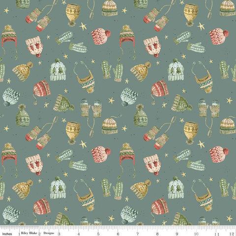 Image of the Magical Winterland Knitwear Winter quilting cotton fabric by Riley Blake Designs. Features tossed hats and mittens on a winter blue background. 
Cute Little Fabric Shop