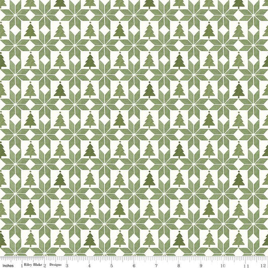 Image of the Magical Winterland Patchwork Green quilting cotton fabric by Riley Blake Designs. Features a quilt design with trees and stars on a green and white background. 
Cute Little Fabric Shop
