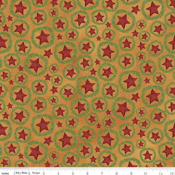 Image of the Up on the Housetop Star Wreaths Moonlight quilting cotton fabric by Riley Blake Designs. Features stars inside of a pine needle wreath on an orange background. 
Cute Little Fabric Shop