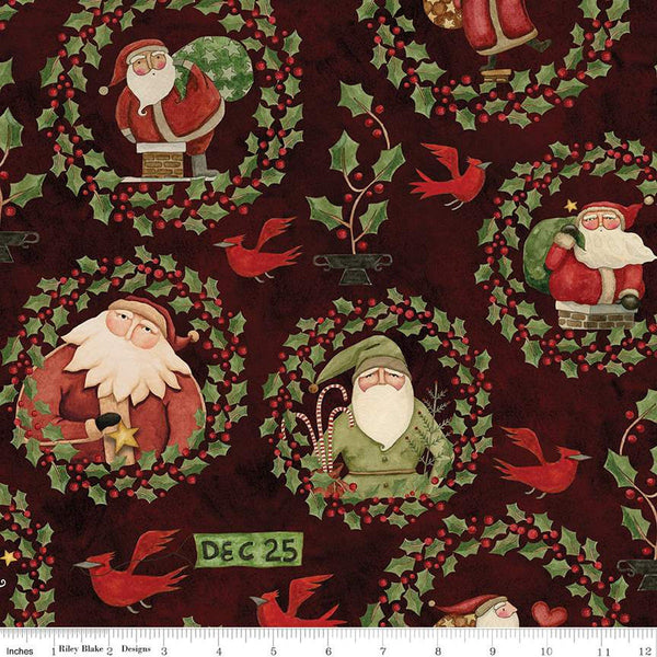 Image of the Up on the Housetop Santa Holly Dark Cranberry quilting cotton fabric by Riley Blake Designs. Features different Santas encircled in holly and berry wreaths on a dark red background. 
Cute Little Fabric Shop