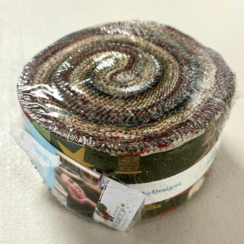 Image of the Up on the Housetop rolie polie from Riley Blake Designs. Features the main dark green fabric on the outside. 
Cute Little Fabric Shop