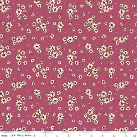 Image of the Autumn Afternoon Daisies Wine quilting cotton fabric by Heather Peterson for Riley Blake Designs. Features clusters of white flowers with green leaves on an purple background. 
Cute Little Fabric Shop