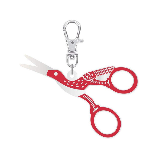 Image of the Lori Holt Enamel Happy Charm Stork Scissors by Riley Blake Designs. Features a scissor charm that has a red stork on the handle. 
Cute Little Fabric Shop