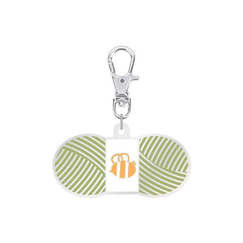 Image of the Lori Holt Enamel Happy Charm Chunky Thread Lettuce by Riley Blake Designs. Features a small enamel charm with green thread.
Cute Little Fabric Shop