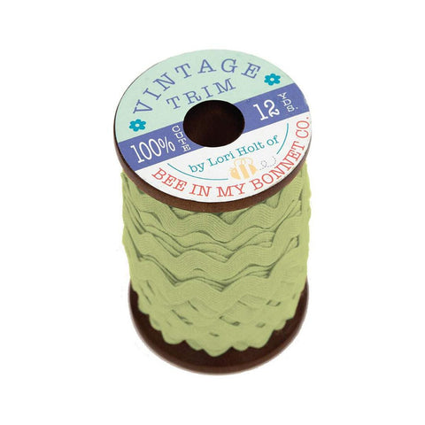 Image of the Lori Holt Vintage Trim Large Lettuce Wooden Spool by Riley Blake Designs. Features light green wavy trim on a wooden spool. 
Cute Little Fabric Shop