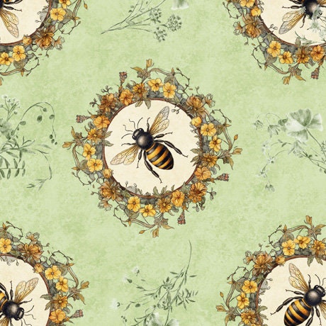 Image of the Queen Bee Bee Circle Vignette Light Sage Minky Fabric by QT Fabrics. Features bees in circular flower wreaths on a light sage green background. 
Cute Little Fabric Shop